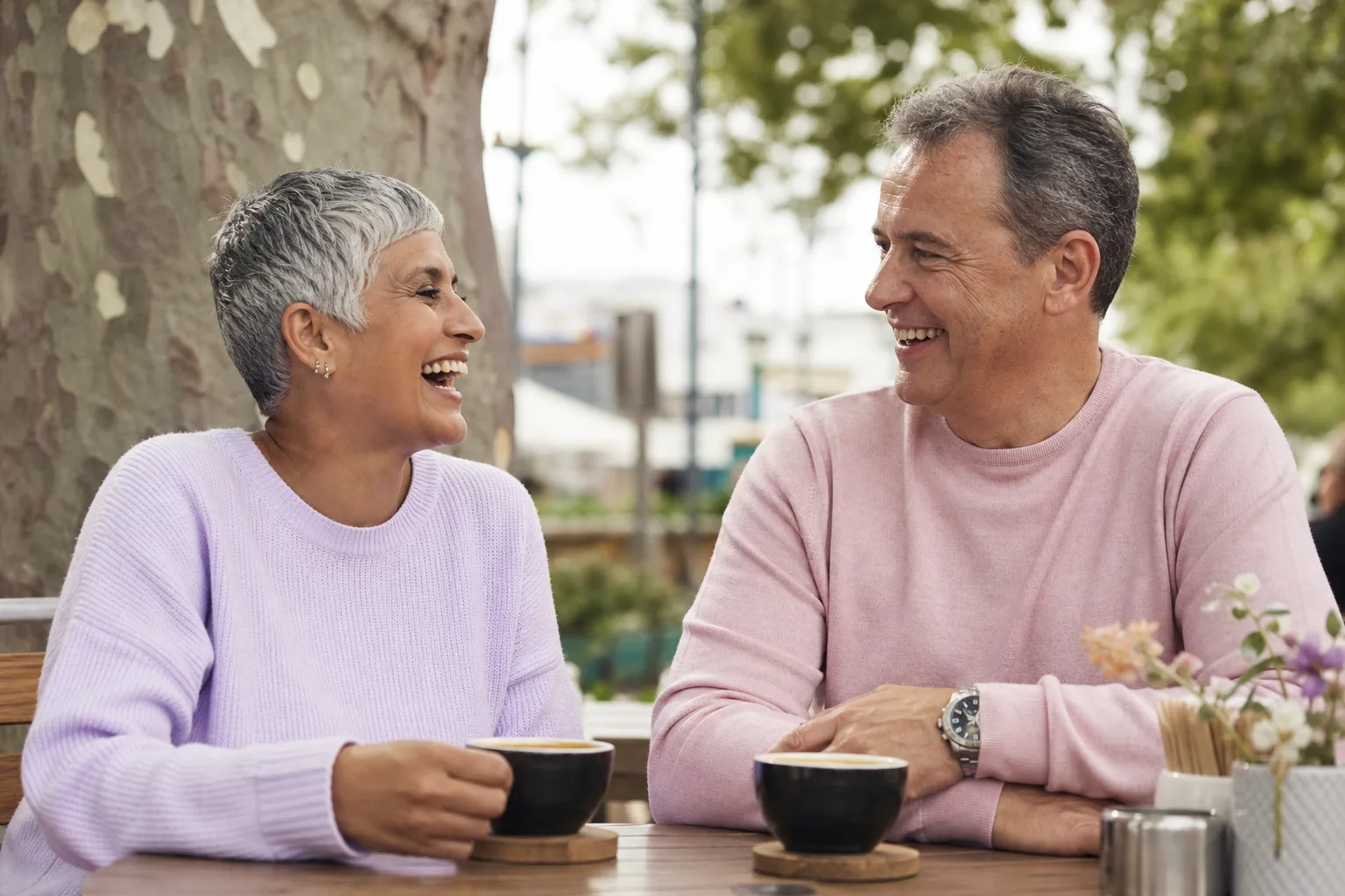 Mature couple talking over coffee in a Somerset town